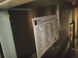 a picture of a sign on the wall of a kitchen