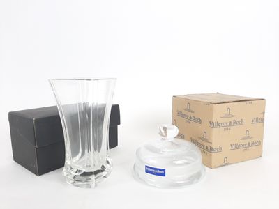 a glass vase and a box on a white surface