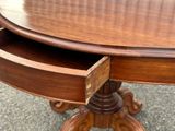 a wooden table with a drawer underneath it