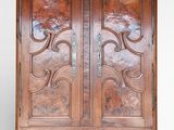 an image of a wooden cabinet with two doors on one side and a drawer on the other