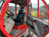 a red vehicle with a black seat and steering wheel