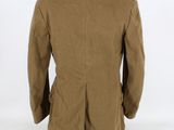 the back view of a brown jacket with a black collar