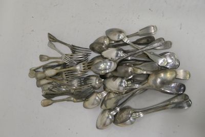 a pile of silver spoons and forks on a table