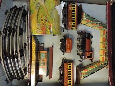 a box with a bunch of toy trains in it