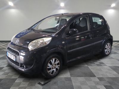 a picture of a small black car on a checkered floor