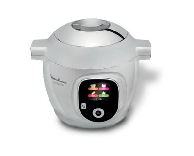 a close up of a white rice cooker on a white surface