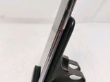 a cell phone that is sitting on a stand