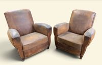 Paire de fauteuils Club en cuir couleur caramel ou havane.