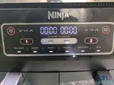 a close up of a digital clock on the side of a toaster