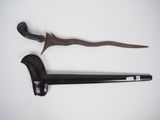 an image of a knife and a cane on a white surface
