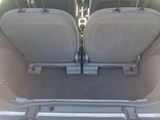 two seats in the back of a car that is empty