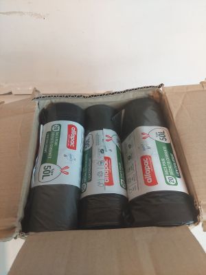 three rolls of black tape in a cardboard box