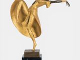 statue of a woman dancing on a black marble base