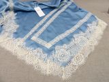 an image of a blue scarf with white lace on it