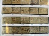 a lot of different types of money on display