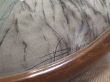 a close up of a bowl with a horse on it