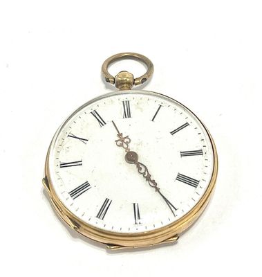 a gold pocket watch with roman numerals on the face