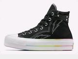 black converse high top sneakers with rainbow soles on a white background