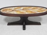 a round coffee table with a marble top and wooden base