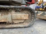 a close up view of a construction vehicle ' s tracks