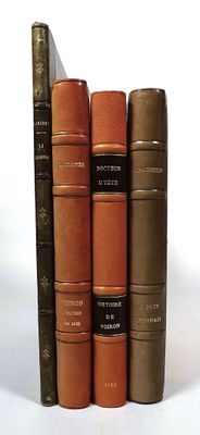 four books that are stacked on top of each other