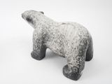 cement sculpture of a polar bear on a white background