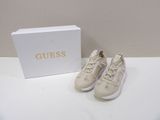 guess sneakers in white with gold logo on the side