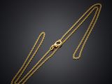a gold chain with a clasp on a black background