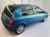 a blue car that is parked in a garage