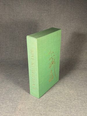 a green box that has a picture of a plant on it