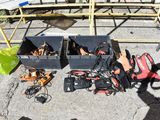 many pairs of shoes that are sitting on the ground