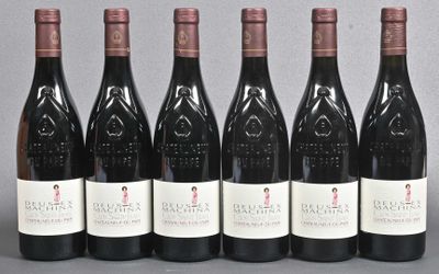 six bottles of wine are lined up in a row on a table