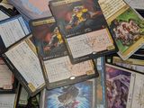 a pile of card game cards on a table