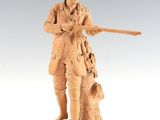 figurine of a man with a gun and a dog