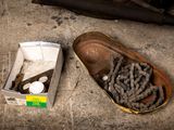 a shoe that is sitting on the ground next to a box