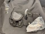 a bag that has a knife and other items in it