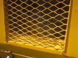 a close up view of a yellow door with a chain link