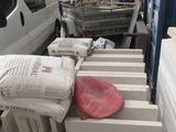 a white van that is parked next to a pile of boxes