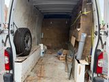 a white van that is parked in a lot