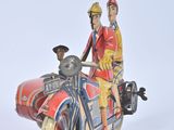 a figurine of a man and a woman on a motorcycle