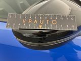 a sticker on the side mirror of a blue car