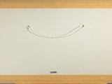 a picture of a drawing of a smiling face on a white board