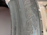 an image of a close up of a tire with a sticker on it
