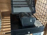 a black suitcase sitting on top of a black counter