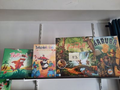 many children ' s books on a shelf in a room