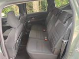 the back seats of a car are empty and the seats are empty
