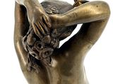bronze statue of a woman holding a bird in her hand