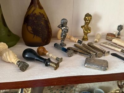 a table with a lot of antique items on it