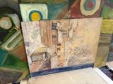 a picture of a painting on a easel in a room