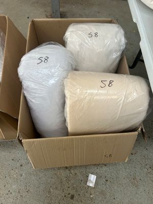 a cardboard box full of toilet paper and rolls of toilet paper